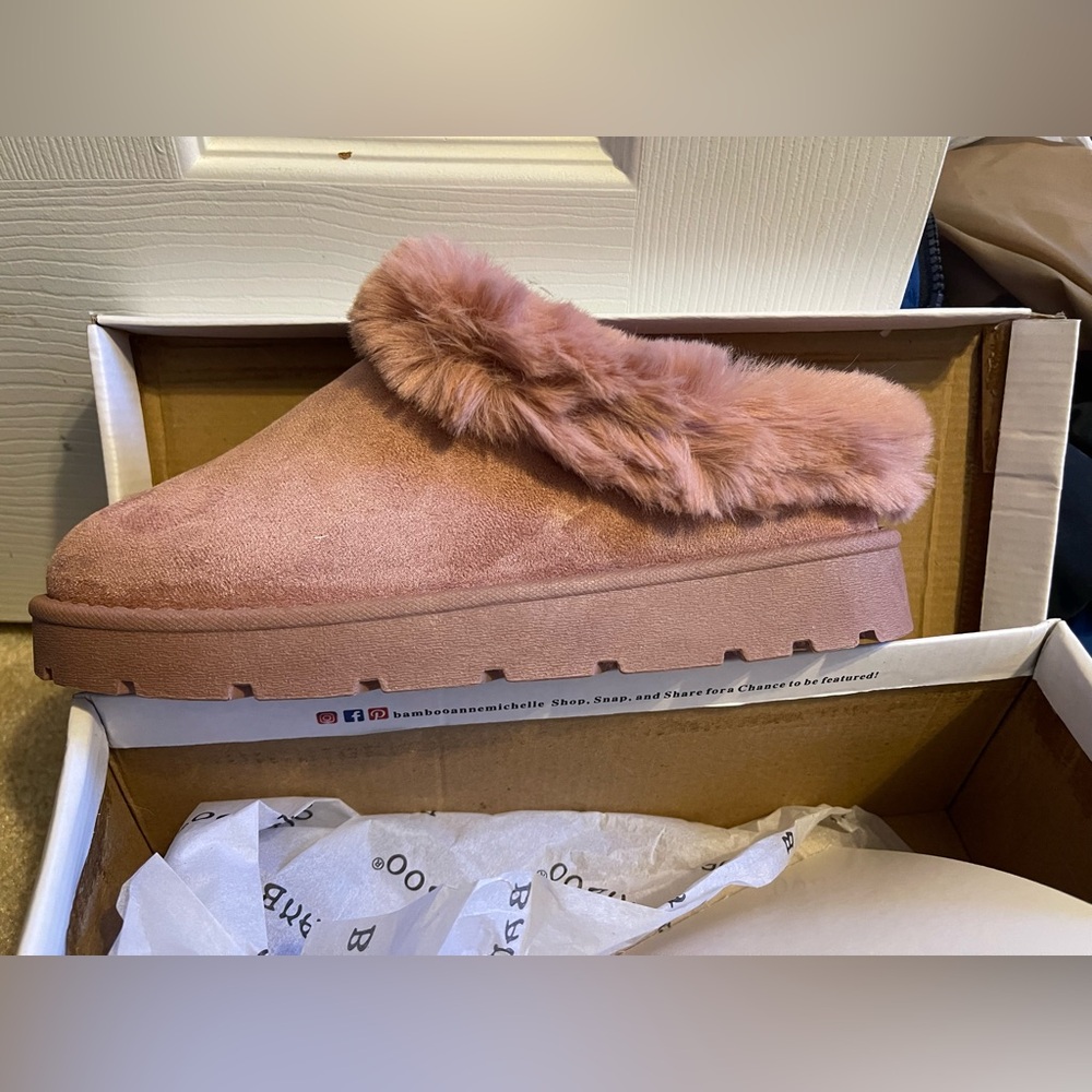 Woman’s fuzzy slides